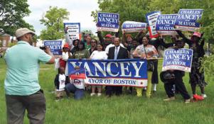 City Councillor Charles Yancey posed with supporters who joined him at the Haitian Unity Parade on Sunday. Yancey has submitted signatures to run for both Mayor and district four council. Bill Forry photo